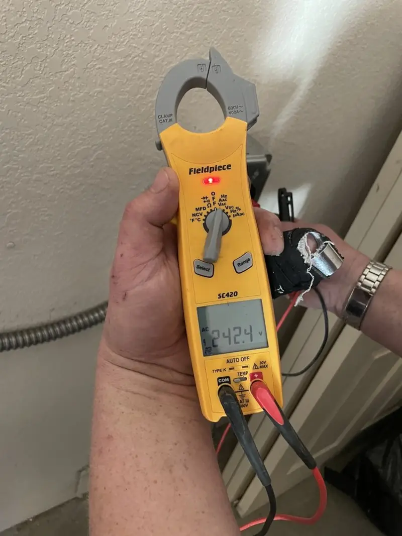 Voltage testing with clamp meter during Electrical Installation Services in Fruitvale